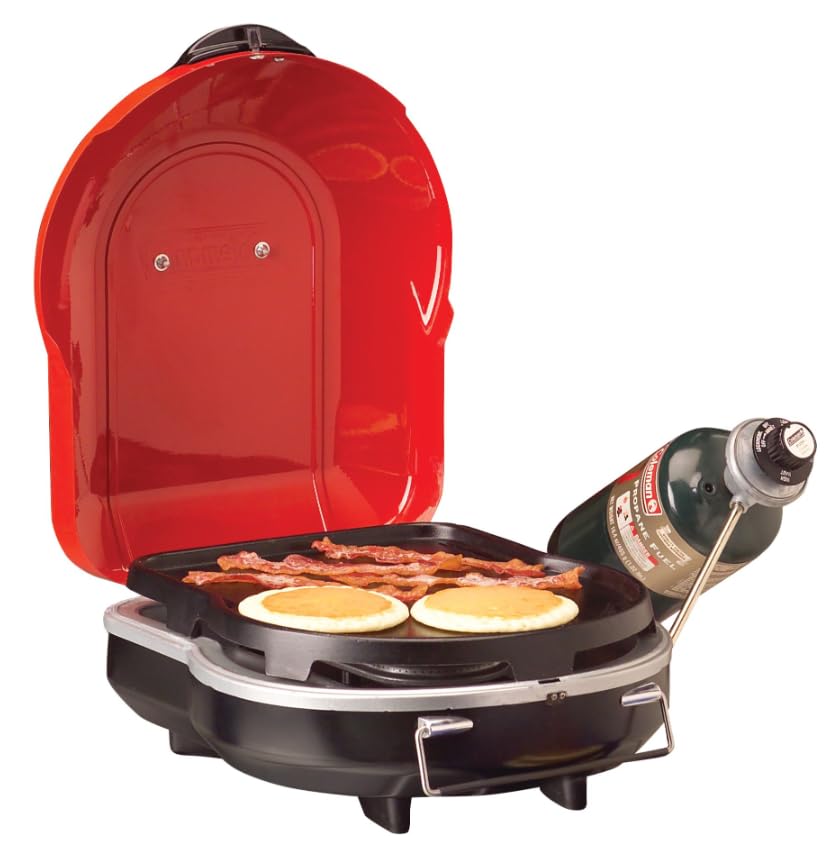 Coleman Fold N Go 6,000 BTU grill open cooking area for versatile backyard meals.