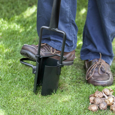 Colwelt bulb planter with serrated base penetrates rocky soil.