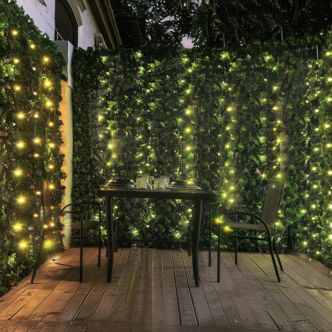 Comtelek faux ivy leaves on fence offer breathable privacy and sun shading for outdoor spaces.