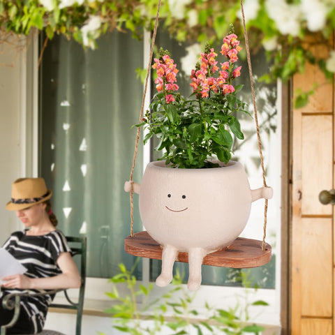 CONNOVA resin planter swinging with motion for decorative display.