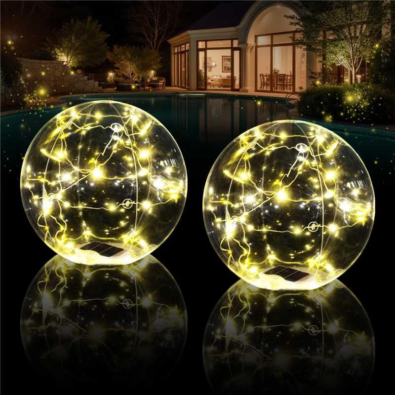 Cootway floating pool lights ball in water glowing with warm solar light for evening swims