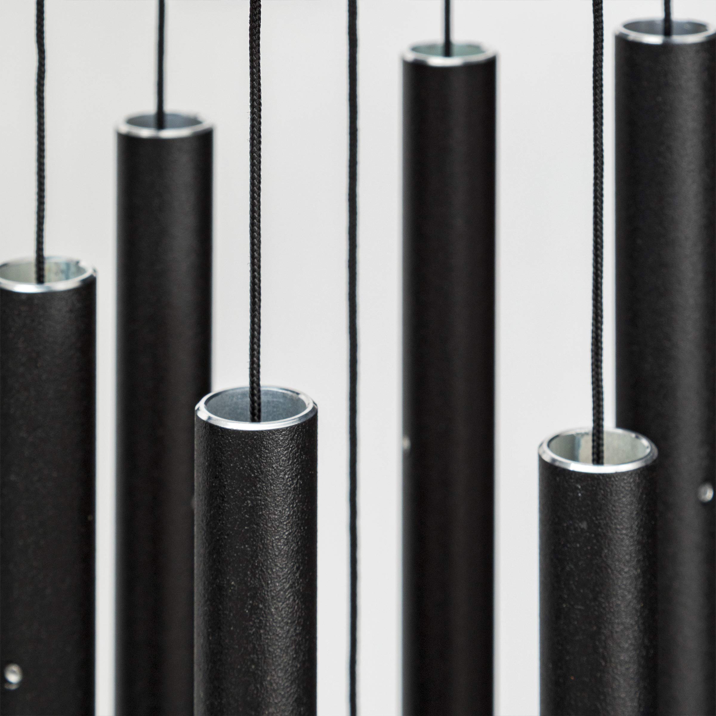 Corinthian Bells 27in black chime tubes closeup, highlighting pentatonic tuning for outdoor tones.