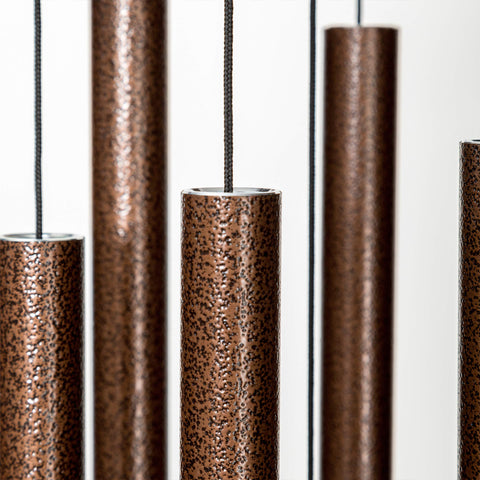 Corinthian Bells wind chime aluminum tubes close-up highlighting durable outdoor construction.