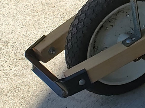 Corona 2506-83 bumper bracket installed on a wheelbarrow for reinforced stability and impact resistance.