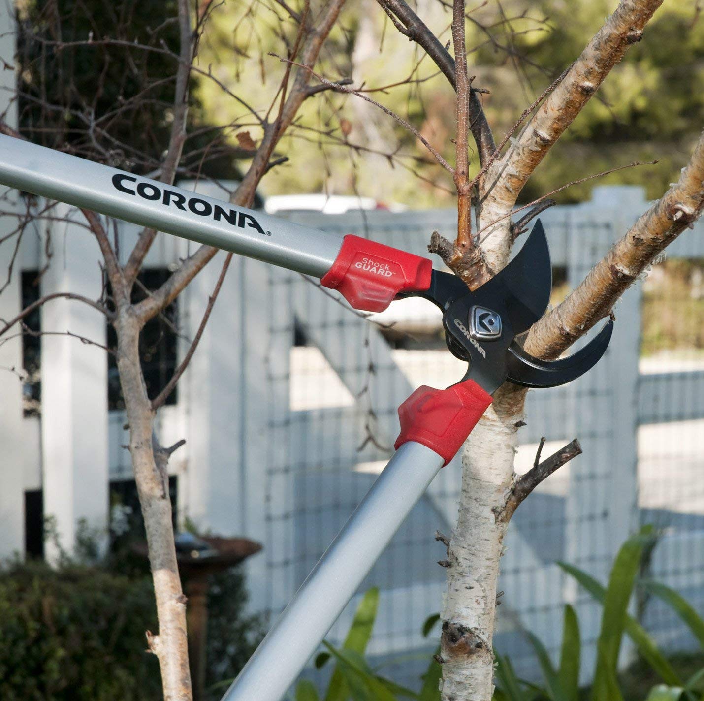 Corona loppers used in garden tasks for efficient pruning