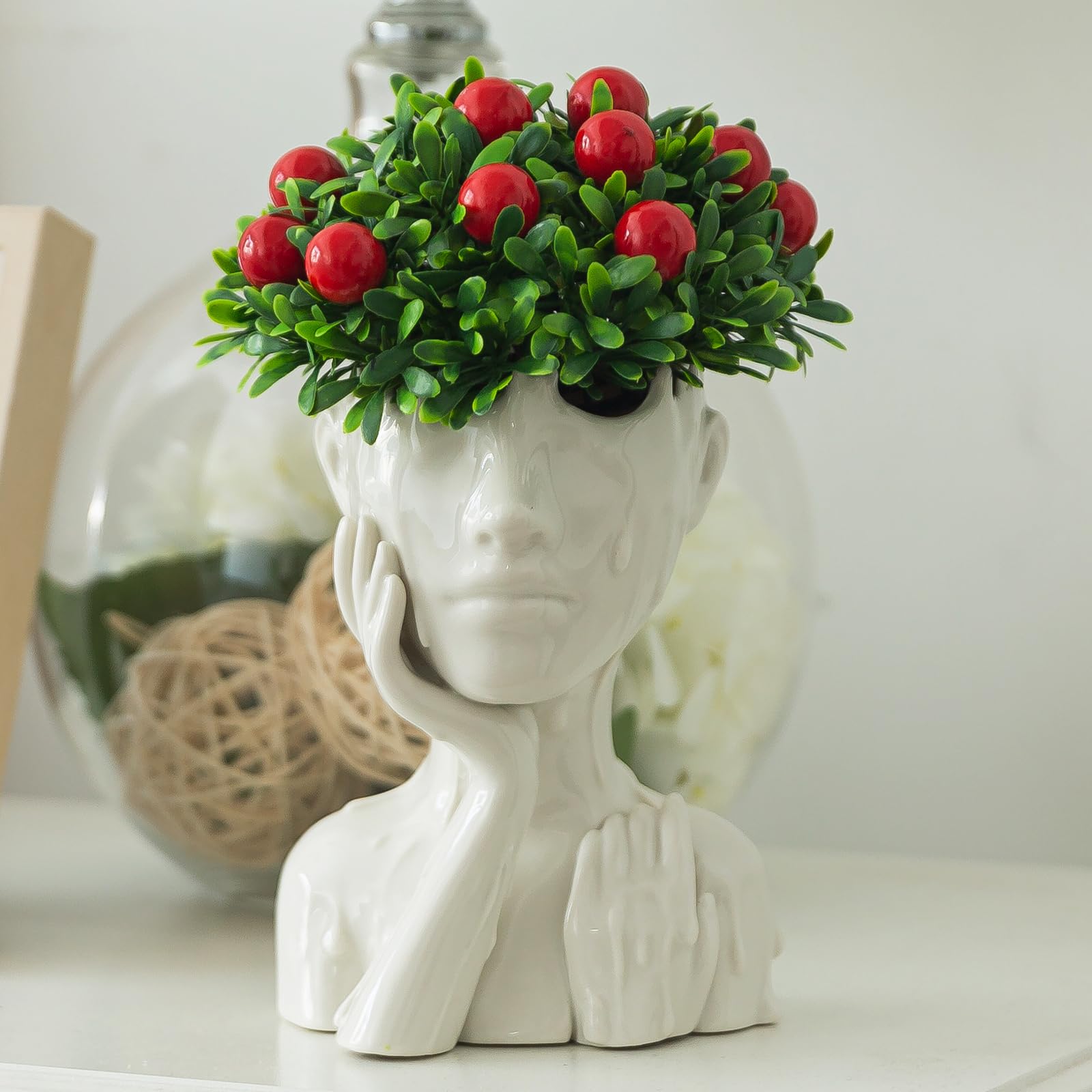 COTYNI weather-resistant ceramic head planter showcases enduring charm