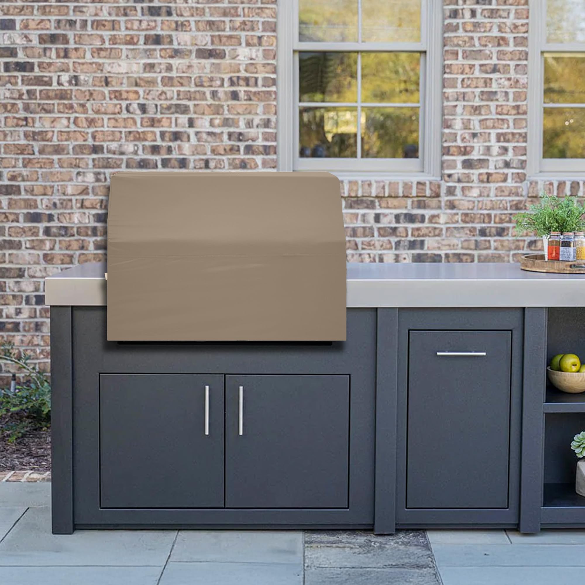 Beige grill cover on outdoor kitchen setup by Covers & All
