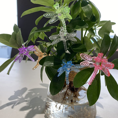 Bright clips add visibility to garden setup near stakes and cages