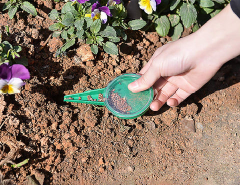 Cozyou seed dispenser dial showing five outlets for controlled seed quantities.
