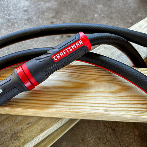 Craftsman hose in action delivering steady water flow across garden beds.