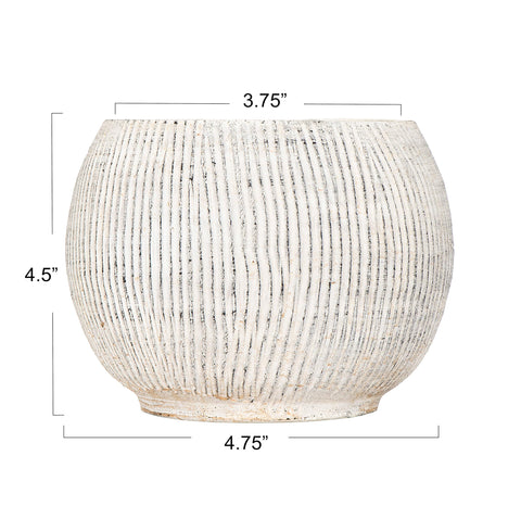 Creative Co-Op terracotta planter with ribbed texture adds tactile charm to a shelf
