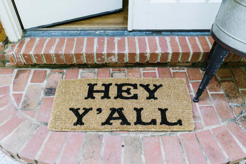Creative Co-Op Hey Y'all Doormat outdoor porch use demonstrates weather-ready entry.