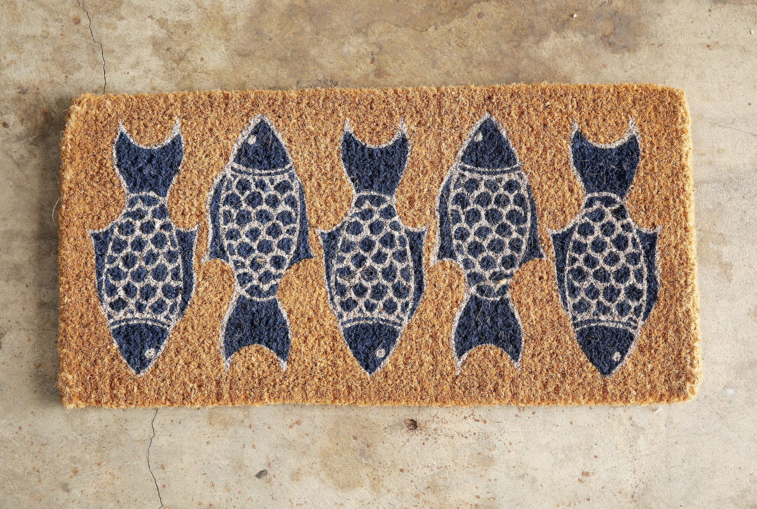Creative Co-Op doormat with fish pattern full view, enhances entryways with coastal charm.
