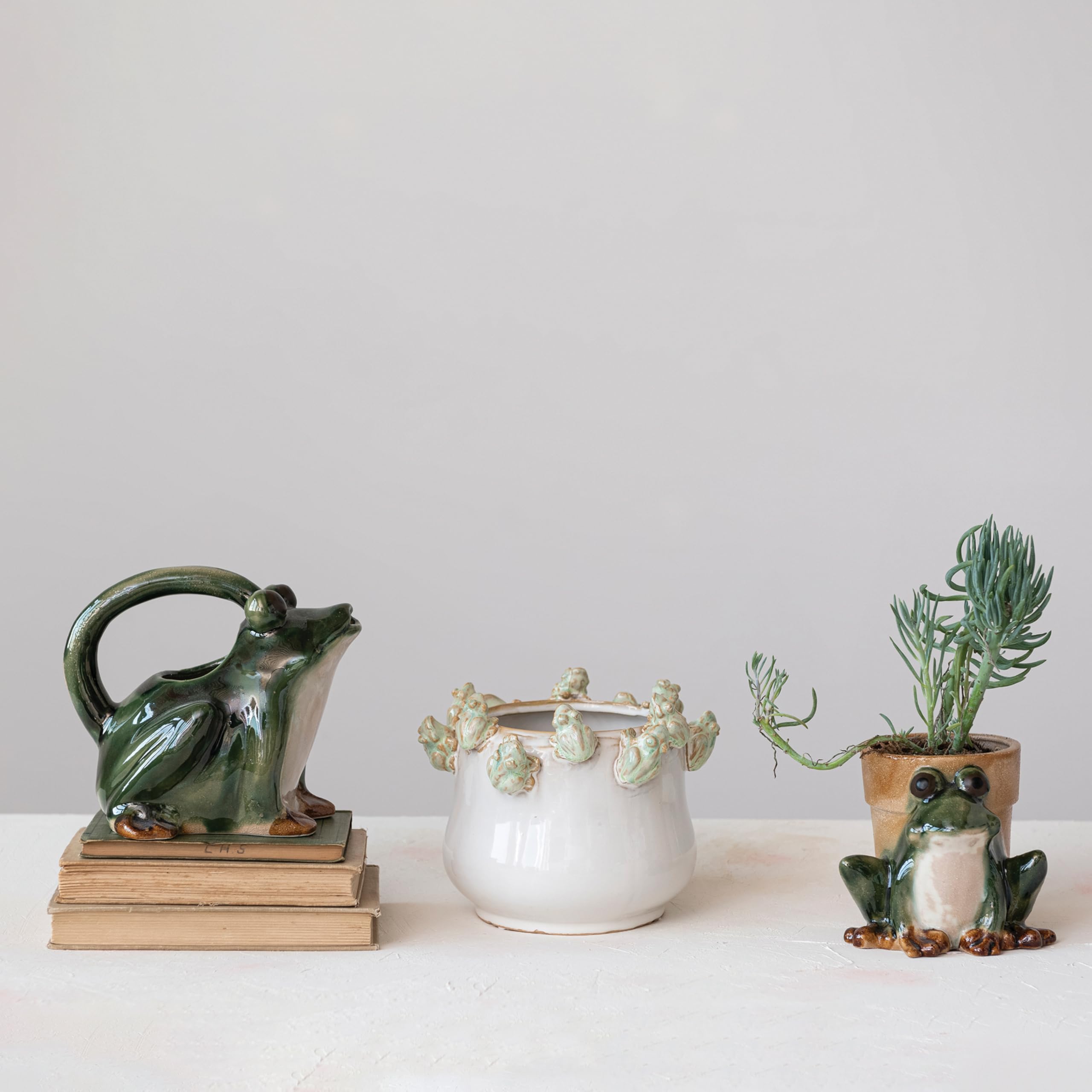 Reactive green and white glaze adds depth to this stoneware planter