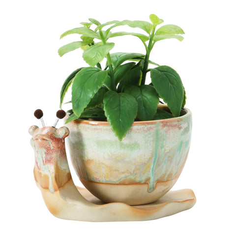 Planter drainage hole and saucer prevent overwatering and surface staining