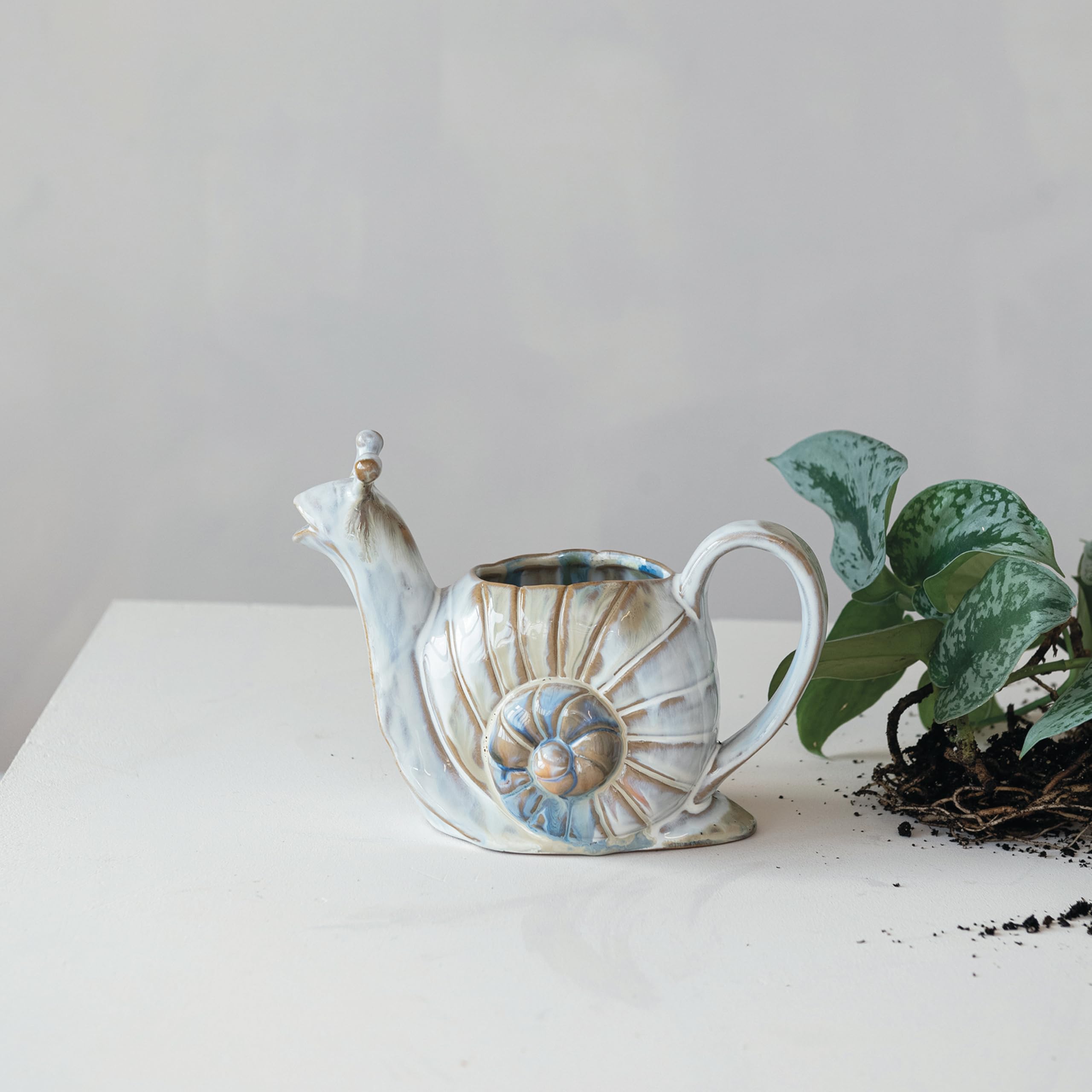 Creative Co-Op snail-shaped watering can with multicolor finish