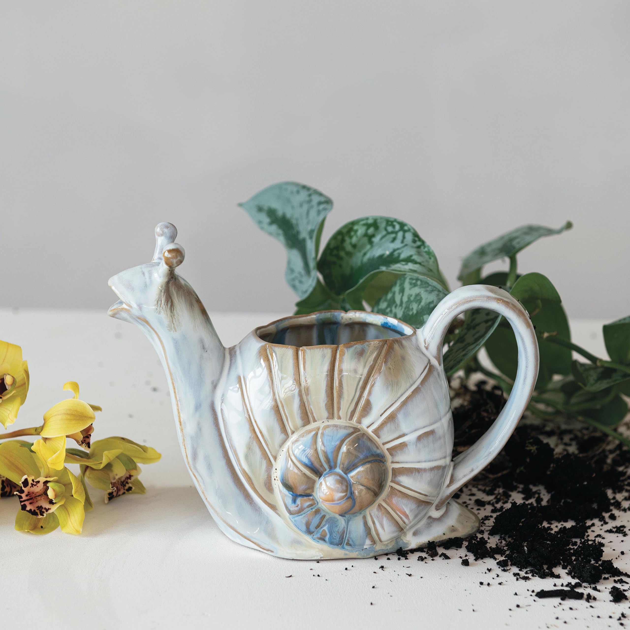 Creative Co-Op snail-shaped watering can side view showing colorful finish