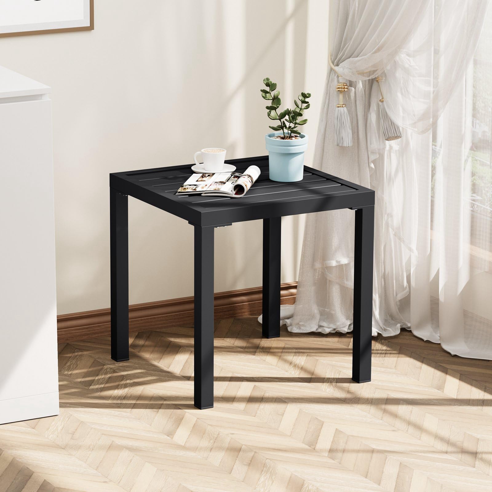 Crestlive table beside lounge chairs holds cups and small essentials.