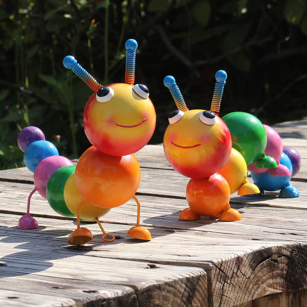 Cruis Cuka metal caterpillar statue adds colorful garden focal point with UV-protected finish.