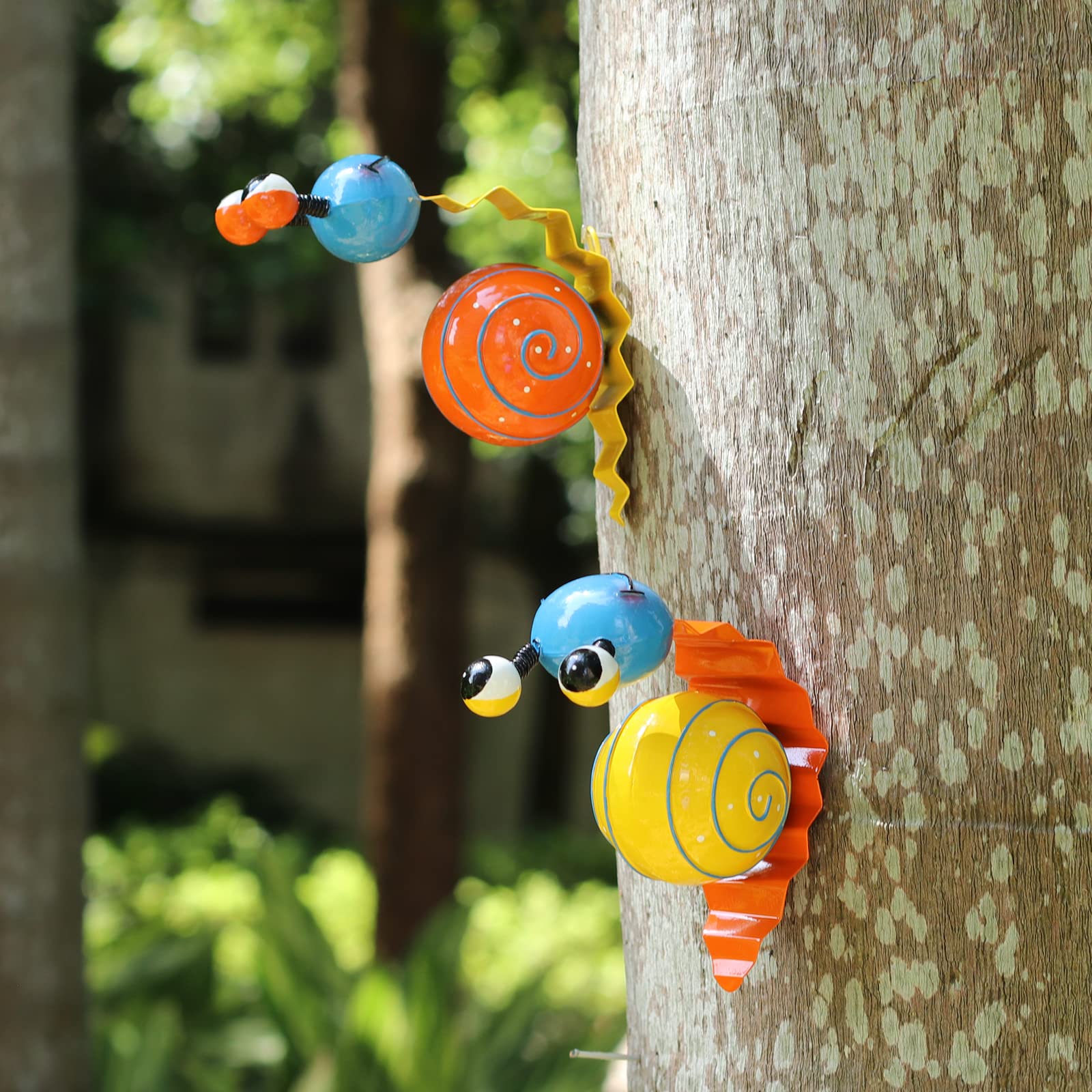 Cruis Cuka snail garden decor in orange adds color to outdoor spaces