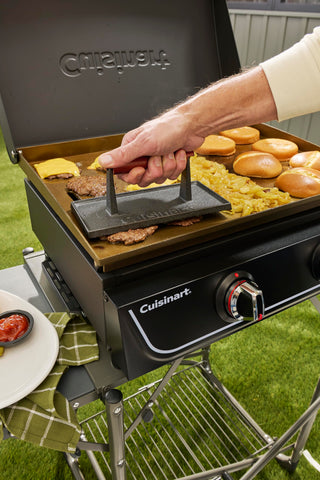 Cuisinart cast iron grill press on stovetop for quick, even cooking