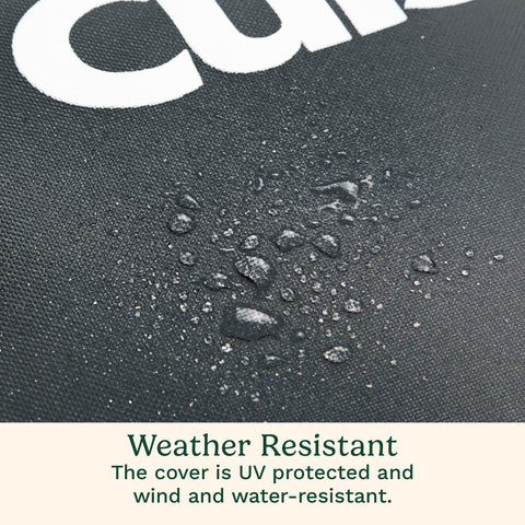 Cuisinart heavy-duty grill cover drawstring and buckle strap secure in wind.