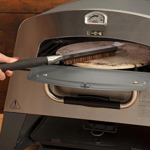 Cuisinart palm-stalk bristles tackling baked-on mess on stone