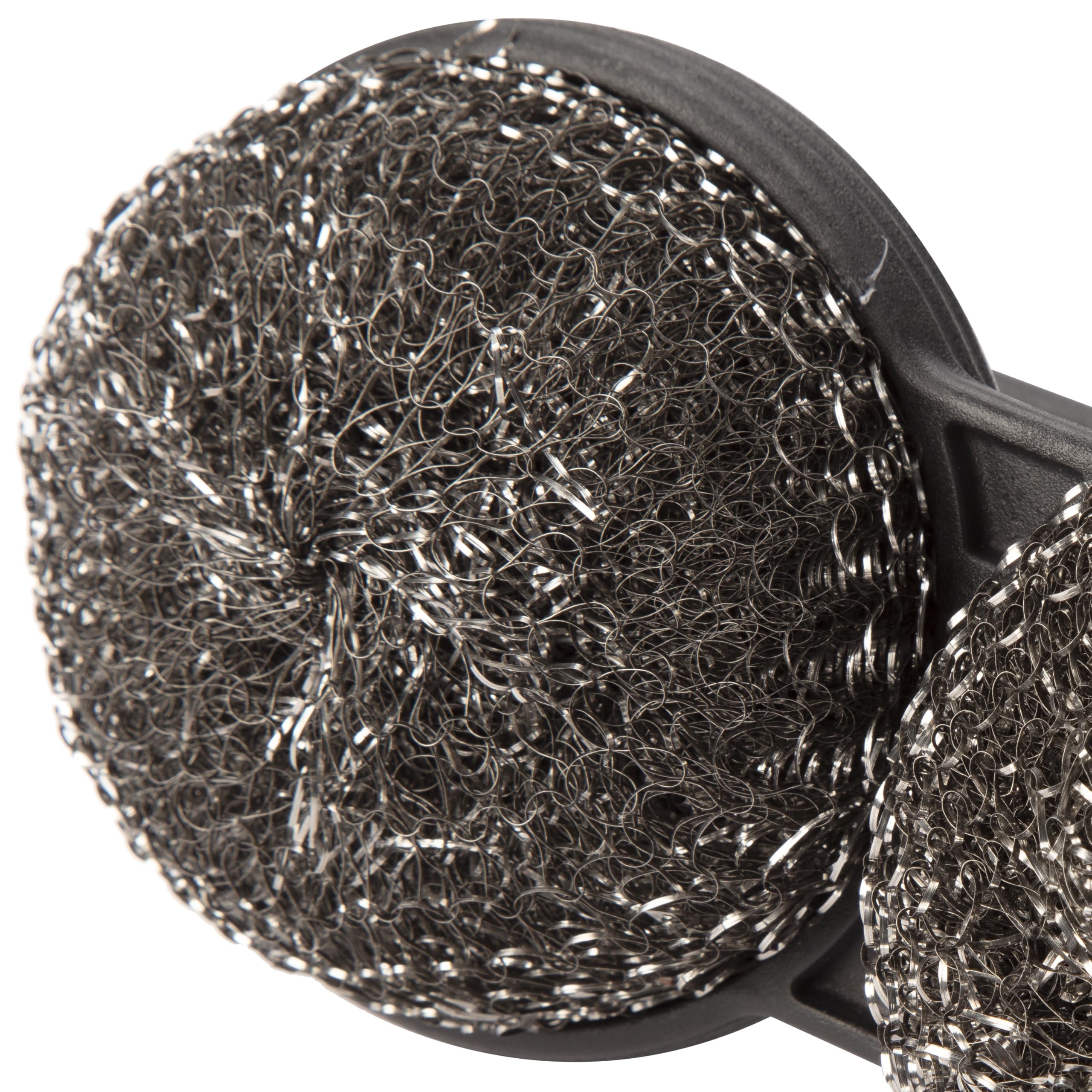 Brush on a hot grate demonstrating circular design leverage.