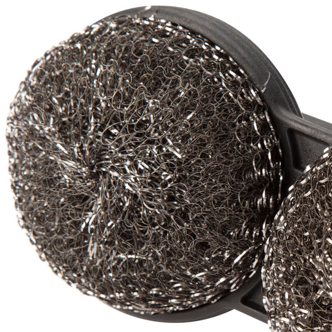Brush on a hot grate demonstrating circular design leverage.