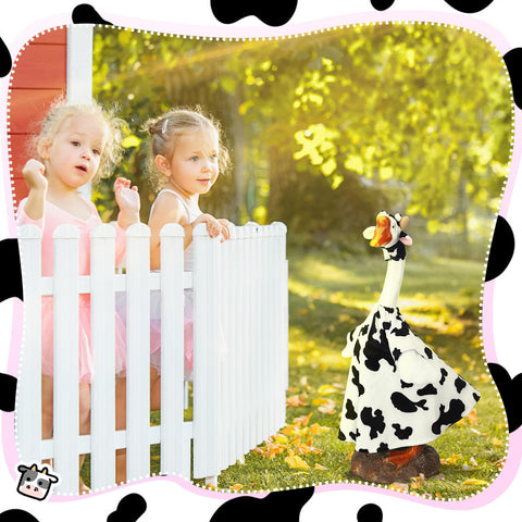 Cutecrop cow-goose costume enhances cement lawn statue with whimsy.