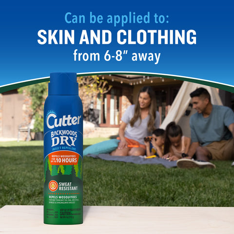 Hiker applying Cutter Backwoods Dry Insect Repellent outdoors