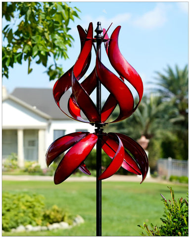 Cyan Oasis large outdoor wind spinner complements garden decor with reflective shine.