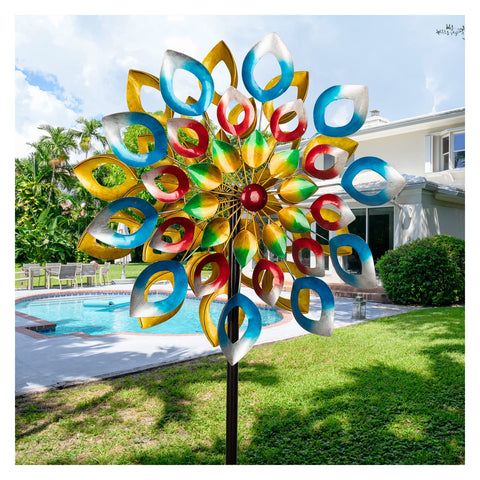 Cyan Oasis wind spinner on stake for durable outdoor motion in the garden