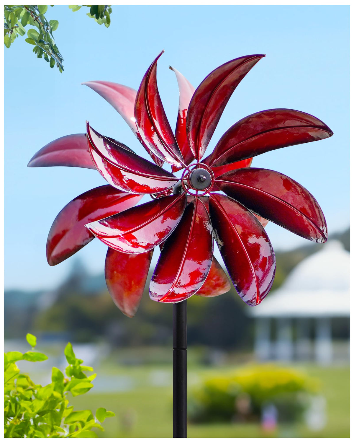Cyan Oasis wind spinners with red windmill and stake for vibrant garden decor.