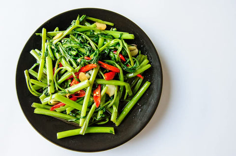 CZ Grain Kong Xin Cai in garden bed for easy home cultivation.