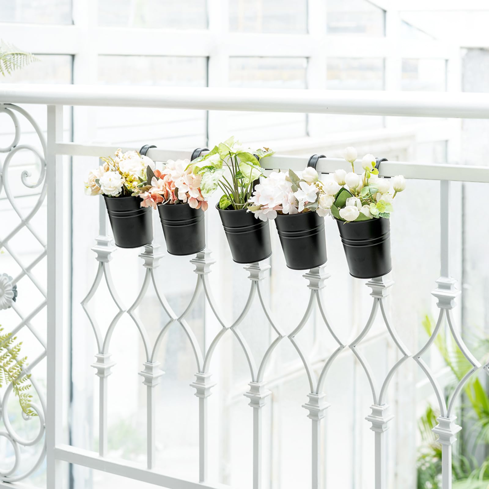 Dahey included hanging plant holder keeps pots secure on a fence or deck.