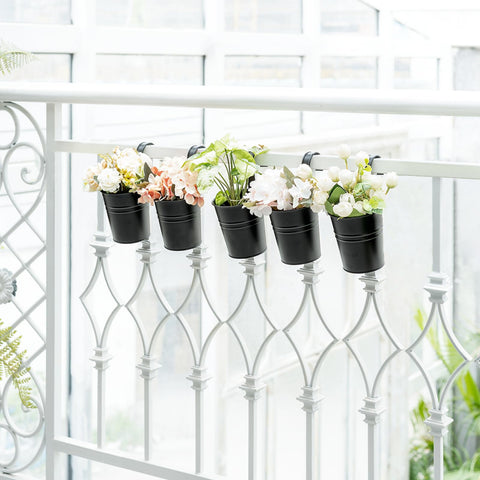 Dahey included hanging plant holder keeps pots secure on a fence or deck.