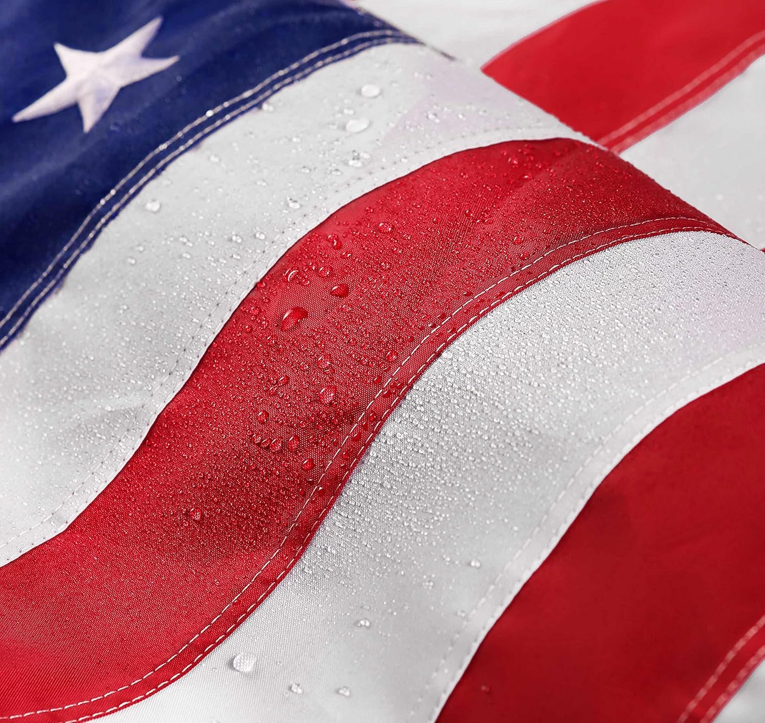 DANF FLAG nylon embroidered stars close-up highlights lasting detail in wind.