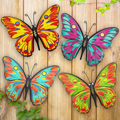 Daogtc four-pack metal butterflies on a sunlit garden fence for outdoor charm