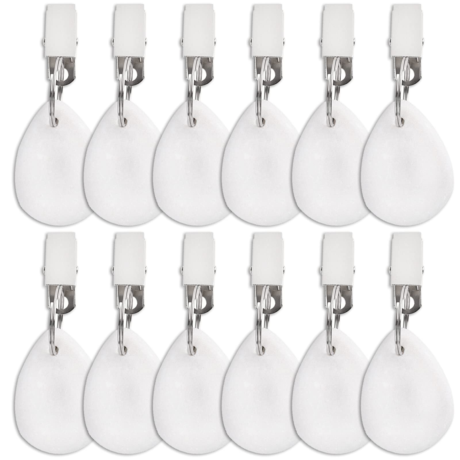 DEAYOU teardrop marble weight with clip securing a white tablecloth outdoors