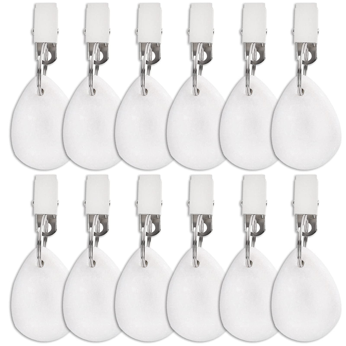 DEAYOU teardrop marble weight with clip securing a white tablecloth outdoors