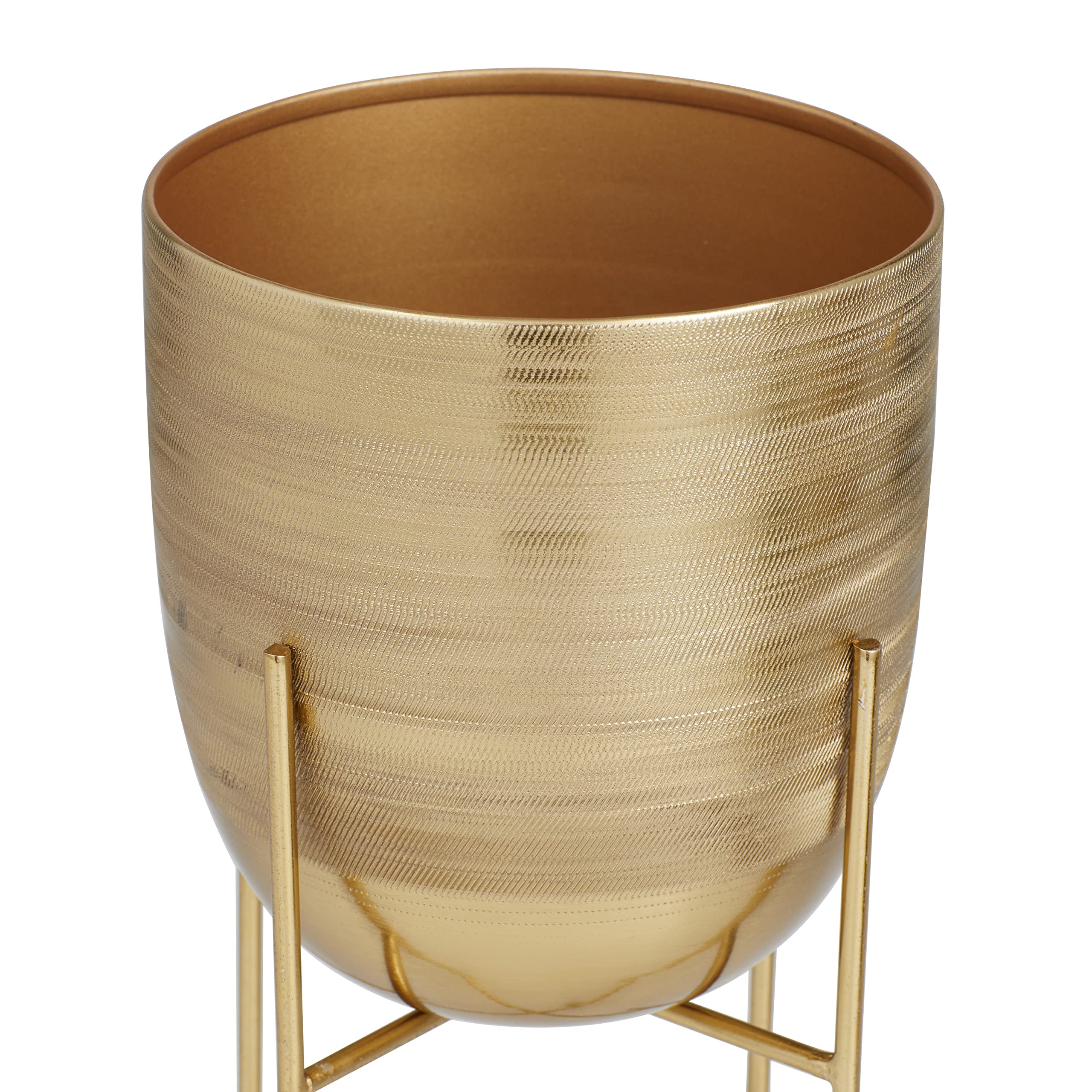 Satin gold finish on Deco 79 metal planters adds contemporary style.