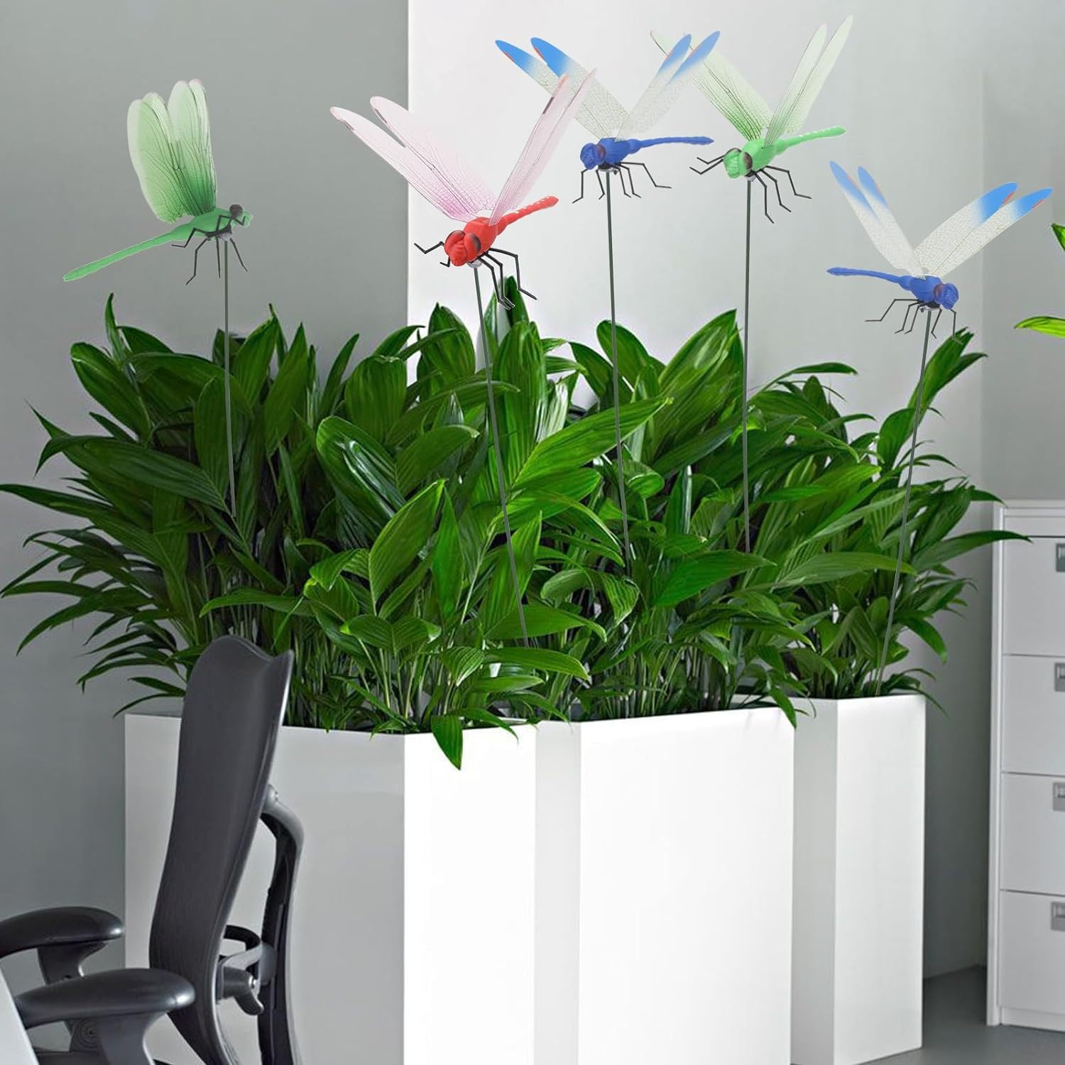 Defemim dragonfly stake green-1 natural tone blends with plants while deterring flies.