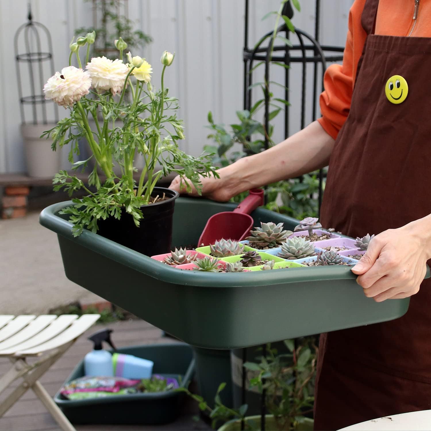 Defemim Garden Tidy Tray organizing multiple pots on a bench