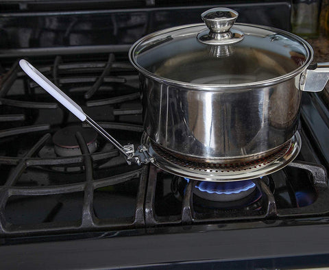 Dele heat diffuser on an electric stove maintains pan temperature evenly