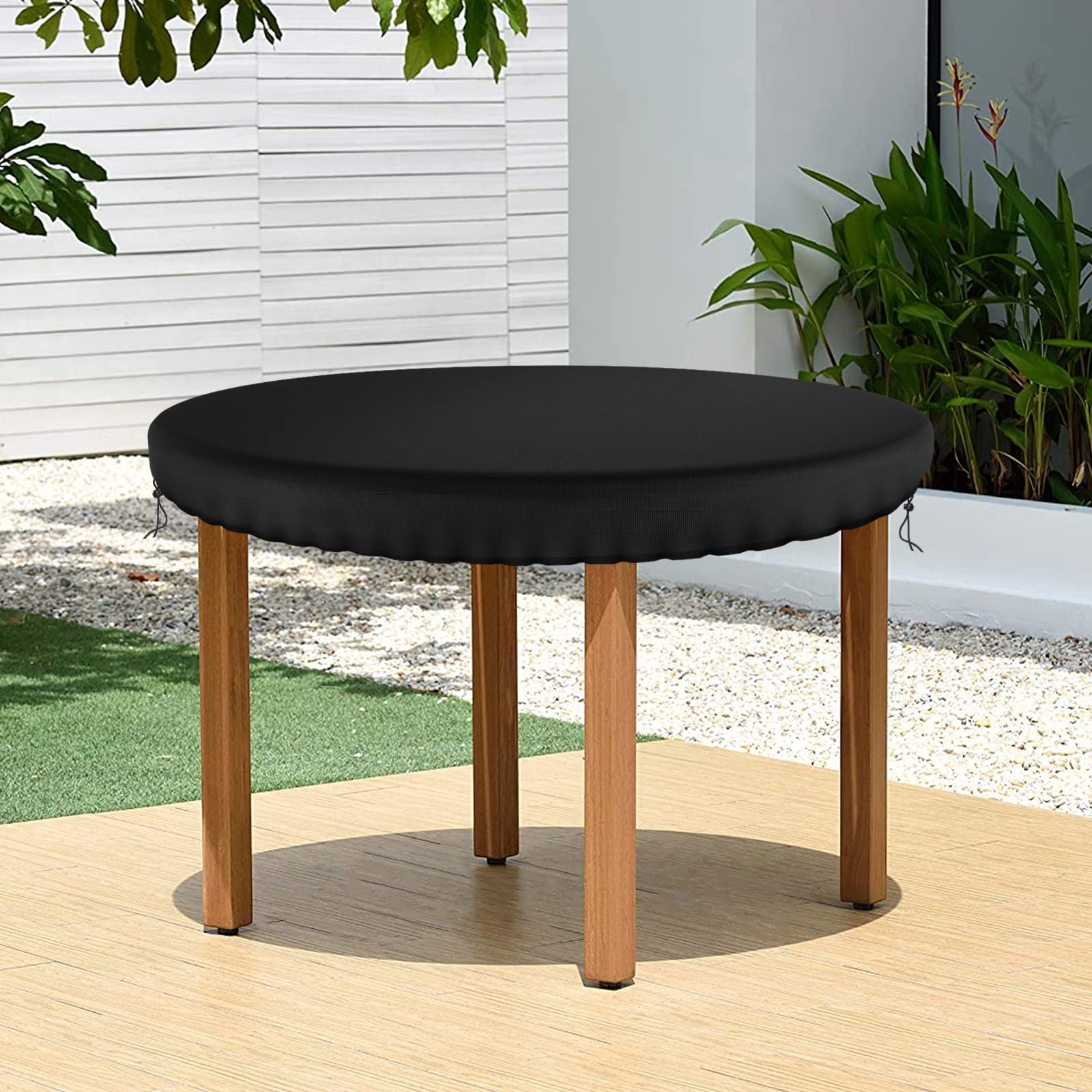 Demao round-table-cover-drawstring-secure shows secure fit in wind.