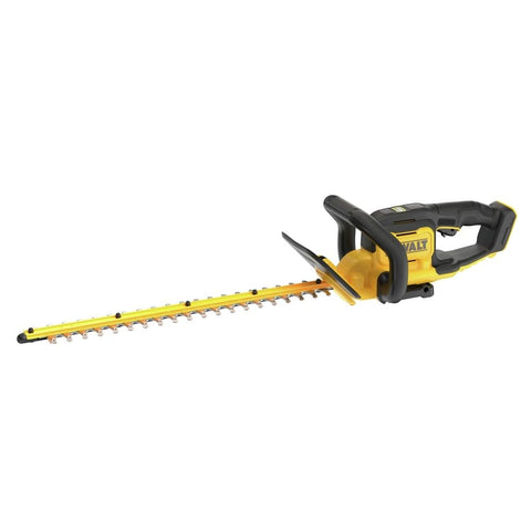 DEWALT DCHT821B hedge trimmer in hand for precise trimming task.