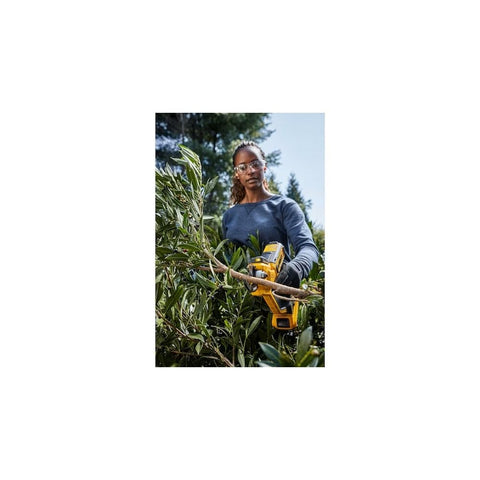 DEWALT DCPR320D1 pruning in bushes demonstrates efficient, clean cuts.