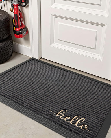 Dexi stylish Hello Grey mat enhances any entryway.