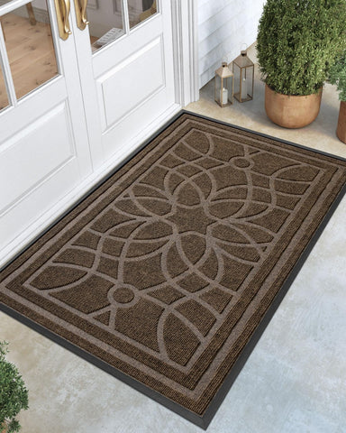 DEXI front door mat with outdoor patterned grooves traps dirt at the entrance.